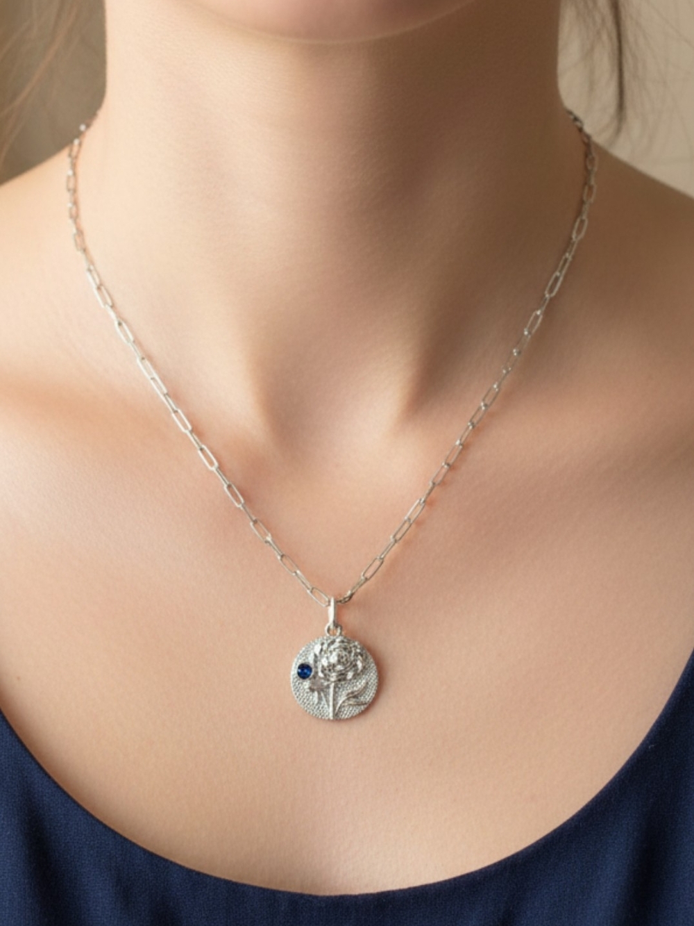 Silver Floral Medallion Necklace with Blue Accent